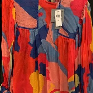 This is a multicolor fall and spring blouse purchased at Anthropologie.